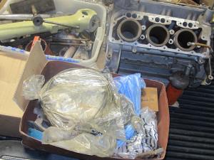 A glimpse of the engine block and a plethora of parts loaded on my Dodge Dakota pick-up